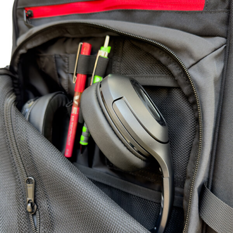 Nokta DetectoBag Backpack Internal Accessory Pocket Nokta DetectoBag interior accessory compartment with headphones, pens, and mesh pockets for metal detecting gear.