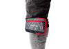Nokta DetectoBag hip pouch in grey and red with zippered pockets, worn on a belt for metal detecting accessories.