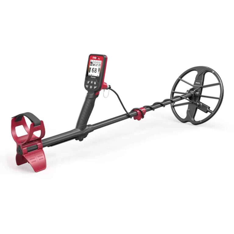 A side-angle view of the Nokta FINDX Pro metal detector in red and black, showing the digital interface, armrest, and circular search coil on a white background.
